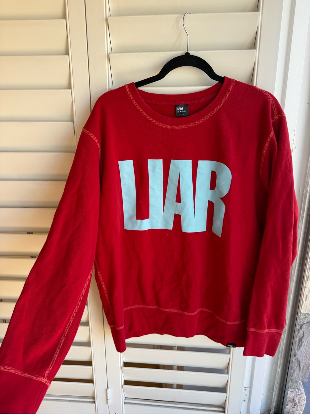Bold Red 'LIAR’ Uniqlo x Moma Special Edition Sweatshirt
